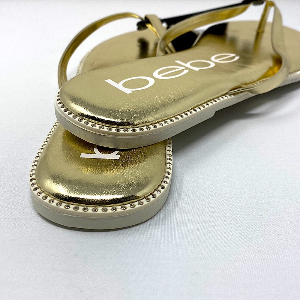Women's bebe 𝐈𝐥𝐞𝐚𝐧𝐚 Gold  thong sandals